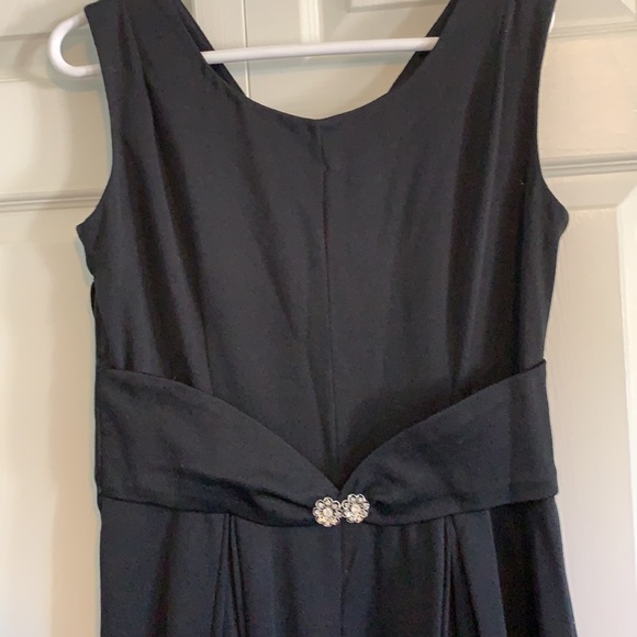 Simple black gown with embellished center. - Picture 2 of 7